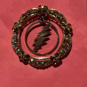 Vintage pin with dead lightning bolt charm